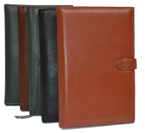 black, green, tan and camel colored leather notebook journals